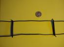Close-up photo of my homemade ladderline made from 1/4-inch dripline tubing and tie wraps.